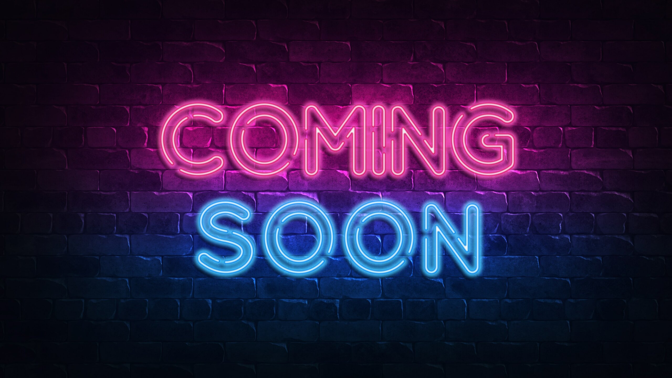 Neon sign with the words 'Coming Soon'